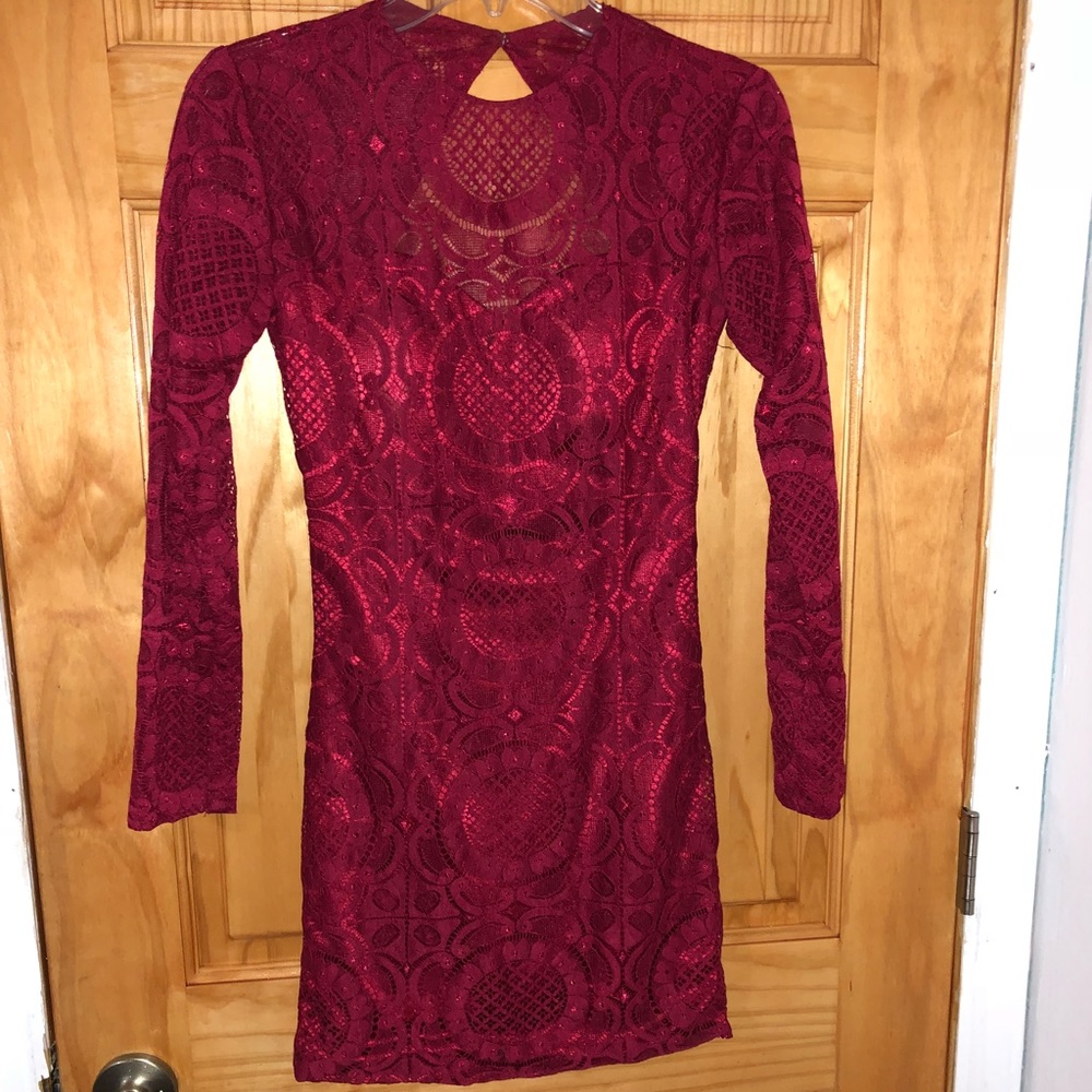 Red long sleeve open back dress
